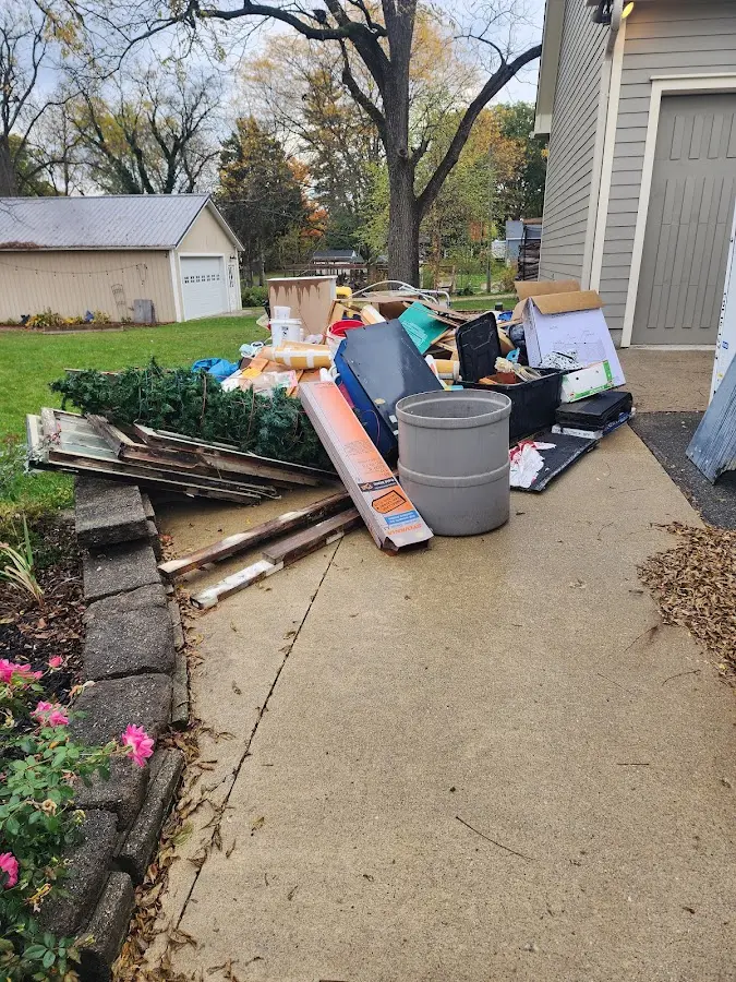 Dumpster being loaded with debris for Roofing Dumpster Rental in Cherryville